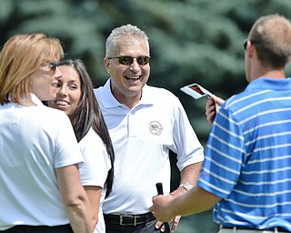 Jeff Lange | The Vindicator  JULY 6, 2015 - Major League Baseball umpire John Hirschbeck (center) shares a moment of laughter with a group of golfers during Monday's Magic of Michael Foundation golf outing held at the Lake Club in Poland.
