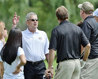 Jeff Lange | The Vindicator  JULY 6, 2015 - Major League Baseball umpire John Hirschbeck (center) informs a group of golfers about another participant's hole in one earlier in the competition during the Magic of Michael Foundation golf outing held at the Lake Club, Monday morning.