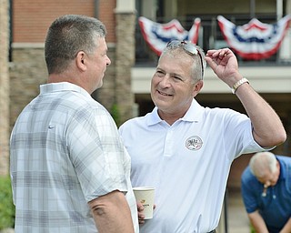 Jeff Lange | The Vindicator  JULY 6, 2015 - MLB umpire John Hirschbeck (right) chats with Tom Slosser of Poland prior to the start of the Magic of Michael Foundation golf outing held at the Lake Club in Poland on Monday.