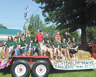 SPECIAL TO THE VINDICATOR
Western Reserve Rangers 4-H Club decorated and rode on a float in the Canfield Fourth of July parade. Paul Hendricks of Professional Engines in Canfield provided the truck, and Millstone Farm and Garden provided the straw for the float. The club encourages patriotism and citizenship by participating in holiday parades.