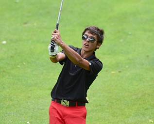 CANFIELD, OHIO - JULY 7, 2015: Jason Paris of Canfield follows through on his approach shot on the 18th hole Tuesday afternoon at Diamondback during a Vindy Greatest Golfer qualifying Tournament. DAVID DERMER | THE VINDICATOR