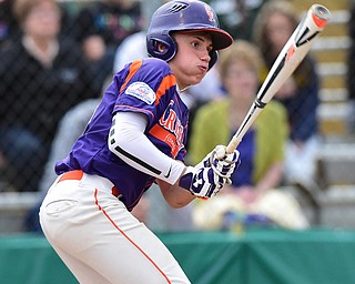 STRUTHERS, OHIO - JULY 8, 2015: Jaydon Johnson #15 of Creekside prepares to run to first after a base hit in the 4th inning during Wednesday nights Little B championship game at Cene Park.