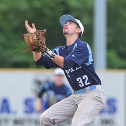 STRUTHERS, OHIO - JULY 10, 2015: Third basemen Ray Belchick #32 of Roth fields the ball after failing to cleanly play the baseball resulting in an error in the 2nd inning during Friday nights Class B baseball game at Cene Park. DAVID DERMER | THE VINDICATOR