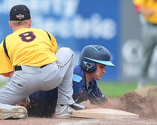STRUTHERS, OHIO - JULY 10, 2015: Base runner Josh Frisk #8 of Roth dives into first base to avoid being picked off by pitcher Dan Boerio #8 of DuraEdge in the 3rd inning during Friday nights Class B baseball game at Cene Park. DAVID DERMER | THE VINDICATOR
