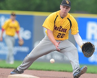 STRUTHERS, OHIO - JULY 10, 2015: First basemen Matt Dayton #22 of DuraEdge plays the baseball on the hop in the 3rd inning during Friday nights Class B baseball game at Cene Park. DAVID DERMER | THE VINDICATOR