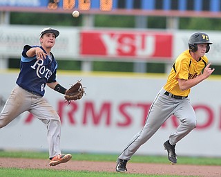 STRUTHERS, OHIO - JULY 10, 2015: Short stop Josh Fristik #8 of Roth throws the ball to first base to pick off base runner Alex Thompson #11 of DuraEdge after he was caught in a rundown in the 5th inning during Friday nights Class B baseball game at Cene Park. DAVID DERMER | THE VINDICATOR