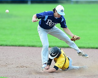 STRUTHERS, OHIO - JULY 10, 2015: Base runner Zach Senchak #5 of DuraEdge steals second base after second basemen Jack Lynch #11 of Roth had the ball knocked out of his glove on the slide in the 7th inning during Friday nights Class B baseball game at Cene Park. DAVID DERMER | THE VINDICATOR