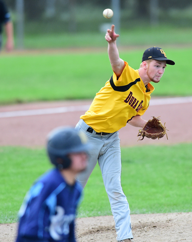 STRUTHERS, OHIO - JULY 10, 2015: Pitcher Dan Boerio #8 of DuraEdge throws the ball to first base for the out after fielding a weak roller in front of the mound in the 7th inning during Friday nights Class B baseball game at Cene Park. DAVID DERMER | THE VINDICATOR