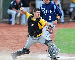 STRUTHERS, OHIO - JULY 10, 2015: Catcher Nathan Sommers #6 of DuraEdge looks to throw the ball to first after stepping on home to force out John Medvec #2 of Roth in the 7th inning during Friday nights Class B baseball game at Cene Park. DAVID DERMER | THE VINDICATOR