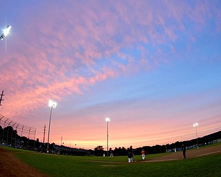 STRUTHERS, OHIO - JULY 10, 2015: The sun sets over Cene Park during a game between the Astro Falcons Rudzik Excavating Friday night. DAVID DERMER | THE VINDICATOR