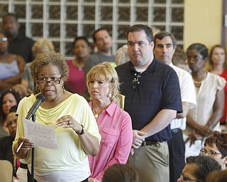        ROBERT K. YOSAY  | THE VINDICATOR..Board Member Jackie Adair .. talks about the issues of the schools  - behind her is Stacie  Erdos from United Way - a huge line was there as each speaker was given two minutes to speak or question ..State Sen. Joe Schiavoni  state Rep. Michele-Lepore-Hagan, Mayor John A. McNally will hosted a meeting  William Holmes McGuffey Elementary School to discuss the Youngstown plan legislated for city schools recovery.  ..