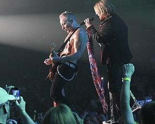 William D Lewis the vindicator  Def Leppard performs 7-15-15 at Covelli Center in Youngstown. Guitarist Phil collen , left, anfd vocalist Joe elliott.