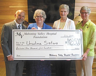 SPECIAL TO THE VINDICATOR
The Mahoning Valley Hospital Foundation recently presented a check to the Ursuline Sisters of Youngstown for the renovation of its Motherhouse health care wing. From left are Mike Senchak, president and chief executive officer of the foundation; Sister Mary McCormick, general superior; and Sisters Patricia McNicholas and Norma Raupple of the nuns’ leadership team.
