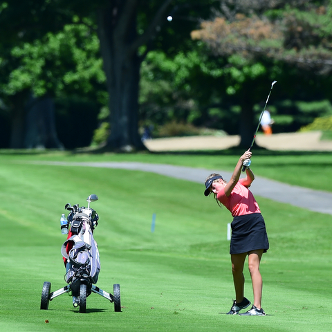 WARREN, OHIO - JULY 16, 2015: Kristin Shelley of Canfield follows through on her approach shot on the 1st hole Thursday afternoon during a Vindy Greatest Golfer qualifying Tournament. DAVID DERMER | THE VINDICATOR