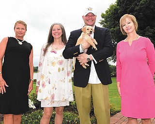 DAVID DERMER | THE VINDICATOR
Looking forward to Angels for Animals’ 25th anniversary dinner are Chairman Stephanie McMurray, Co-founder Diane Less, Vice President Scott McCuskey and Janet Flynn. McCuskey holds Karibou.