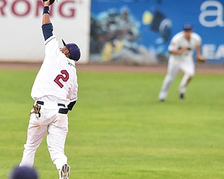NILES, OHIO - JULY 17, 2015: Short stop Willi Castro #2 of the Scrappers extends but is unable to catch the base ball allowing a Doubledays hit allowing a run to score in the 5th inning during Friday nights game at Eastwood Field. DAVID DERMER | THE VINDICATOR