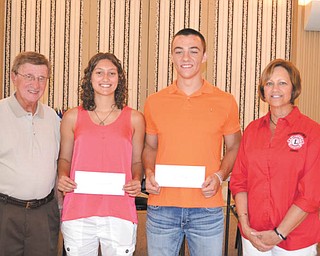 SPECIAL TO THE VINDICATOR
Leetonia High School co-valedictorians Miranda Stark and Trent Ferry each received $400 Rita Merz Memorial Scholarships from the Youngstown Lions Club at its July 9 meeting. Stark will attend Youngstown State University and major in forensic science. Ferry will attend Ohio State University and plans to become a physical therapist. The scholarship is in memory of Rita Merz, who served in the club and spent her life helping others. From left are George Kolesar, club president; Stark; Ferry; and Diane Hardenbrook, club treasurer.