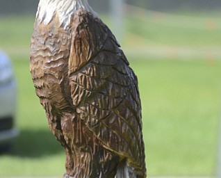 Katie Rickman | The Vindicator.One of the many statues hand carved by R & S  Woodcarving on display at the Trumbull County Fairgrounds on Saturday, July 18, 2015.