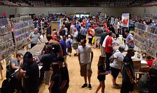 WARREN, OHIO - JULY 18, 2015: Patrons walks to different booths to check out what is for sale Saturday afternoon at Packard Music Hall during All-Americon 6. DAVID DERMER | THE VINDICATOR.