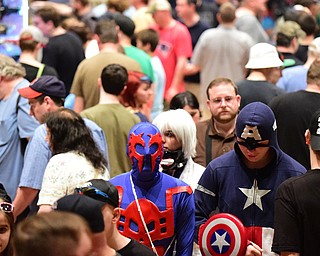 WARREN, OHIO - JULY 18, 2015: Carl Sopkovich of Hubbard, dressed as Spiderman 2099 and Tanner Fulcher of Niles, dressed as Captian America walk amongst other patrons Saturday afternoon at Packard Music Hall during All-Americon 6. DAVID DERMER | THE VINDICATOR.