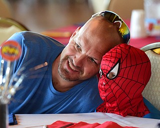 WARREN, OHIO - JULY 19, 2015: Emerson Reese 3, of Garretsville takes a picture with his dad Michael Reese Sunday morning at the Hippodrome ballroom during a Superhero experience event. DAVID DERMER | THE VINDICATOR