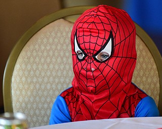 WARREN, OHIO - JULY 19, 2015: Emerson Reese 3, of Garretsville sits in his chair while dressed as spiderman Sunday morning at the Hippodrome ballroom during a Superhero experience event. DAVID DERMER | THE VINDICATOR
