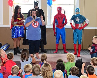 WARREN, OHIO - JULY 19, 2015: Jennifer Campbell the founder of Moxie Productions talks on stage with superhero's behind her Sunday morning at the Hippodrome ballroom during a Superhero experience event. DAVID DERMER | THE VINDICATOR.