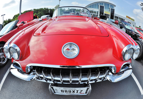 Jeff Lange | The Vindicator  JULY 19, 2015 - Seeming to sport a big smile and a historical plate is this classic 1958 Corvette owned by Dave Murdoch of Canfield during Sunday's Mahoning Valley Corvettes Club car show held at Greenwood Chevrolet in Austintown.