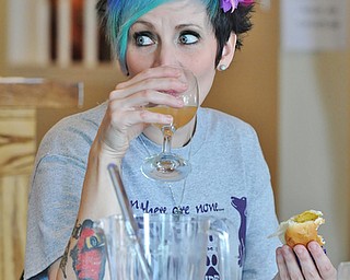 Jeff Lange | The Vindicator  JULY 18, 2015 - Erin Yale of Niles takes a sip of her drink as she enjoys a meal of veggie hotdogs during Saturday's Hot Diggity Dog Day held at Lil Paws Winery in Lake Milton.
