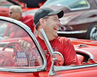 Jeff Lange | The Vindicator  JULY 19, 2015 - Paul Kessler of Brimfield shares a moment of laughter with Dave Murdoch, the owner of this 1958 Corvette during Sunday's Mahoning Valley Corvettes Club car show in Austintown.