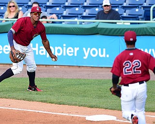 NILES, OHIO - JULY 22, 2015: First basemen Emmanuel Tapia #6 of the Scrappers flips the ball to pitcher Jared Robinson #22 for the out in the 1st inning of Wednesday nights game at Eastwood Field. DAVID DERMER | THE VINDICATOR