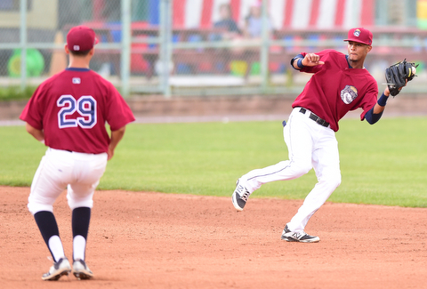 NILES, OHIO - JULY 22, 2015: Short stop Willi Castro #2 of the Scrappers fields the baseball preventing a hit before flipping it to second basemen Mark Mathias #29 for the force out in the 4th inning of Wednesday nights game at Eastwood Field. DAVID DERMER | THE VINDICATOR