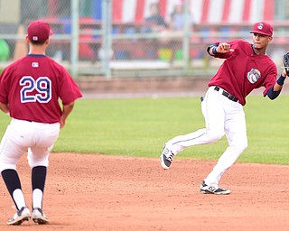 NILES, OHIO - JULY 22, 2015: Short stop Willi Castro #2 of the Scrappers fields the baseball preventing a hit before flipping it to second basemen Mark Mathias #29 for the force out in the 4th inning of Wednesday nights game at Eastwood Field. DAVID DERMER | THE VINDICATOR