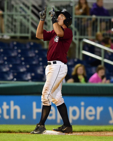 NILES, OHIO - JULY 22, 2015: Daniel Salters #12 of the Scrappers celebrates on third base after a fielding error allowed him to reach third in the 12th inning of Wednesday nights game at Eastwood Field. DAVID DERMER | THE VINDICATOR
