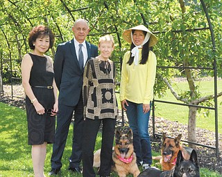 SPECIAL TO THE VINDICATOR
Summer Serenade to support the Youngstown Symphony Society’s education outreach program will take place at the Bruno residence in Canfield on Aug. 15. Preparing for the event are, from left, Florence Wang, committee chairman; Thomas Phillips, Symphony Society board chairman; Patricia Syak, society president; and LinQing Yang, hostess.