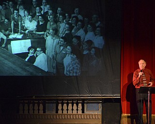 Katie Rickman | The Vindicator.Rodd Coonce sings "As Time goes By" as photos from the past play on overhead screen during the "Exit Stage Left" tribute to the late Bentley Lenhoff Saturday July 25, 2015 at the playhouse.