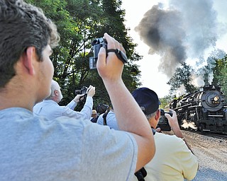Jeff Lange | The Vindicator  JULY 25, 2015 - Train enthusiasts gather at the Covelli Centre in Youngstown to photograph a 1944 vintage steam locomotive prior to boarding for a trip to Ashtabula, Saturday morning.