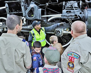 Jeff Lange | The Vindicator  JULY 25, 2015 - Crew chief for Nickelplate 765 Joe Knapke (facing) gives a tour of the outside of the 1944 steam powered locomotive to members of Boy Scouts Pack 25 of Canfield, Saturday morning behind the Covelli Centre in Youngstown.