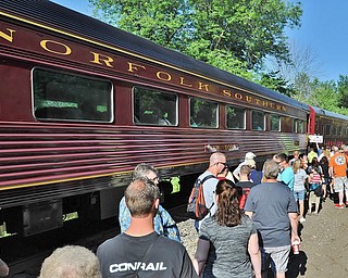 Jeff Lange | The Vindicator  JULY 25, 2015 - A line of people wait patiently to board a vintage 1944 steam powered train, Saturday morning behind the Covelli Centre in Youngstown.