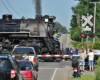 Jeff Lange | The Vindicator  JULY 25, 2015 - As onlookers gathered, the Nickel Plate Road No. 765 crosses State Route 304 in Hubbard on it's way through. The train left the Covelli Centre Saturday morning taking train enthusiasts for a ride to Ashtabula for $79 to $449.
