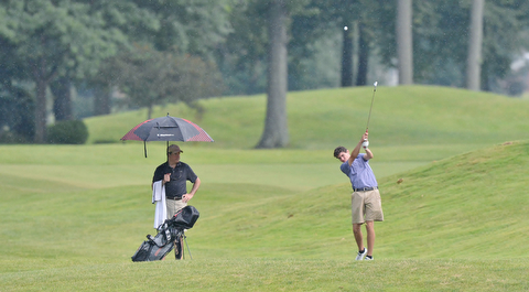 Jeff Lange | The Vindicator  JULY 26, 2015 - Jacob Wilson of Kennedy Catholic High School hits an approach shot in the rain during Sunday's Greatest Golfer of the Valley Junior championship held at Avalon Lakes Golf & Country Club in Howland.