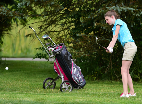 HUBBARD, OHIO - JUNE 26, 2015: Madison Dailey of Mohawk chips toward the green on the 11th hole Friday afternoon at Pine Lakes during a Vindy Greatest Golfer qualifying Tournament. DAVID DERMER | THE VINDICATOR