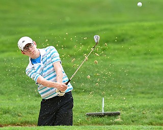 VIENNA, OHIO - MAY 17, 2015: Zavier Bokan of McDonald chips out of the bunker and onto the green on the 4th hole Sunday afternoon at Squaw Creek Country Club during the Vindy Greatest Golfer junior qualifier. (Photo by David Dermer/Youngstown Vindicator)
