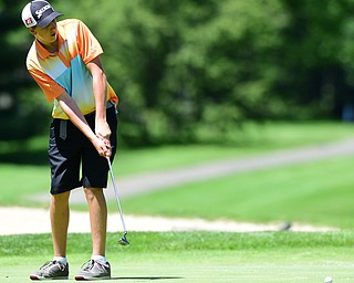 WARREN, OHIO - JULY 16, 2015: Brian Kordupel of Boardman follows through on his putt on the 13th hole Thursday afternoon during a Vindy Greatest Golfer qualifying Tournament. DAVID DERMER | THE VINDICATOR