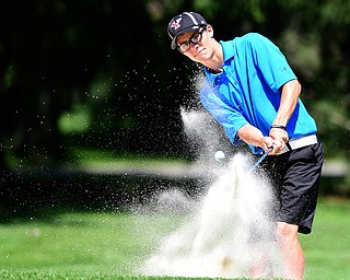 WARREN, OHIO - JULY 16, 2015: Carl Ross of Youngstown chips out of the sand and toward the green on the 8th hole Thursday afternoon during a Vindy Greatest Golfer qualifying Tournament. DAVID DERMER | THE VINDICATOR