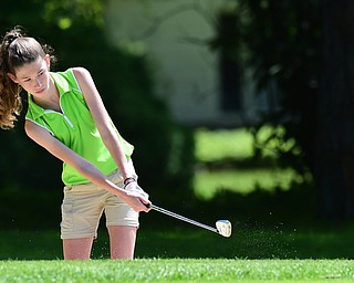 WARREN, OHIO - JULY 16, 2015: Madison Dailey of Mohawk chips out of the sand on the 3rd hole Thursday afternoon during a Vindy Greatest Golfer qualifying Tournament. DAVID DERMER | THE VINDICATOR