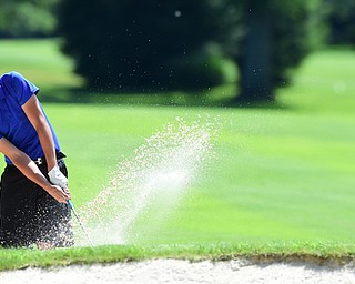 WARREN, OHIO - JULY 16, 2015: Kobe Emery of New Wilmington chips out of the sand on the 5th hole Thursday afternoon during a Vindy Greatest Golfer qualifying Tournament. DAVID DERMER | THE VINDICATOR