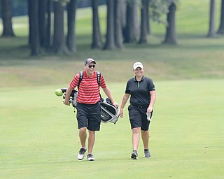 Jeff Lange | The Vindicator  JULY 26, 2015 - Kaylee Newmeister of Lakeview shares a moment of laughter with her father Lance as they walk the fairway during Sunday's Greatest Golfer of the Valley championship in Howland. Kaylee took first place in the girls 17 and under.