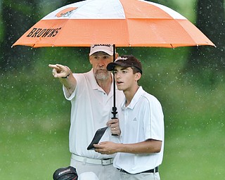 Jeff Lange | The Vindicator JULY 26, 2015 - Girard's Anthony Granziano (right) receives instruction from personal coach John Perry of Houston, Texas during Sunday afternoon's Greatest Golfer of the Valley Junior championship held at Avalon Lakes Golf & Country Club in Howland.