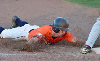 STRUTHERS, OHIO - JULY 31, 2015: Riley Campbell #6 of Youngstown Cene slides head first to advance to third on a wild pitch in the 1st inning during Friday nights PONY tournament game at Cene Park. DAVID DERMER | THE VINDICATOR